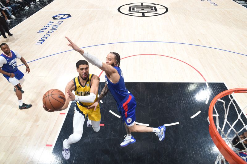 LOS ANGELES, CA - MARCH 25: Tyrese Haliburton #0 of the Indiana Pacers drives to the basket during the game against the LA Clippers on March 25, 2024 at Crypto.Com Arena in Los Angeles, California. NOTE TO USER: User expressly acknowledges and agrees that, by downloading and/or using this Photograph, user is consenting to the terms and conditions of the Getty Images License Agreement. Mandatory Copyright Notice: Copyright 2024 NBAE (Photo by Adam Pantozzi/NBAE via Getty Images)