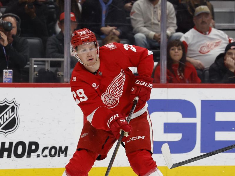 Nov 18, 2025; Detroit, Michigan, USA; Detroit Red Wings center Nate Danielson (29) plays the puck in the second period against the Seattle Kraken at Little Caesars Arena. Mandatory Credit: Rick Osentoski-Imagn Images