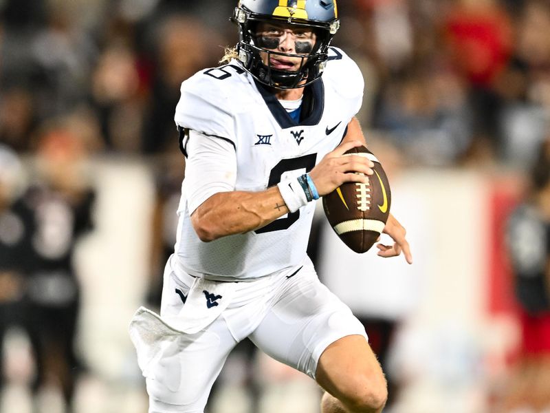 Oct 12, 2023; Houston, Texas, USA; West Virginia Mountaineers quarterback Garrett Greene (6) runs the ball in for a touchdown during the fourth quarter against the Houston Cougars  at TDECU Stadium. Mandatory Credit: Maria Lysaker-USA TODAY Sports