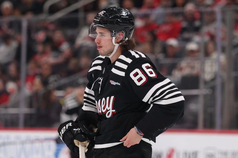 Mar 12, 2026; Newark, New Jersey, USA; New Jersey Devils center Jack Hughes (86) skates off the ice after a high stick against the Calgary Flames during the first period at Prudential Center. Mandatory Credit: Ed Mulholland-Imagn Images