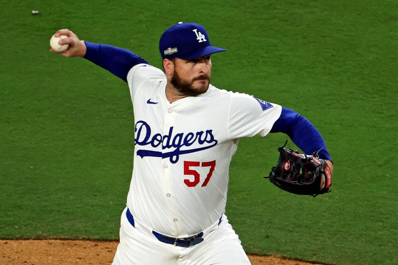 Oct 20, 2024; Los Angeles, California, USA; Los Angeles Dodgers pitcher Ryan Brasier (57) during the fifth inning during game six of the NLCS for the 2024 MLB playoffs at Dodger Stadium. Mandatory Credit: Kiyoshi Mio-Imagn Images