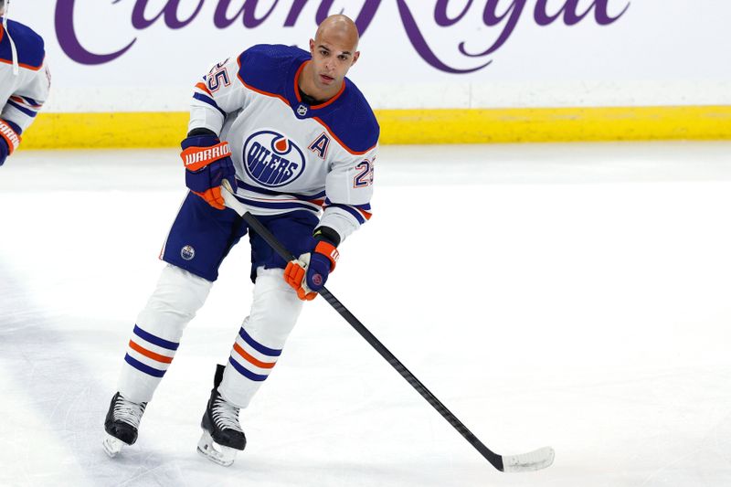 Mar 26, 2024; Winnipeg, Manitoba, CAN; Edmonton Oilers defenseman Darnell Nurse (25) warms up before a game against the Winnipeg Jets at Canada Life Centre. Mandatory Credit: James Carey Lauder-USA TODAY Sports