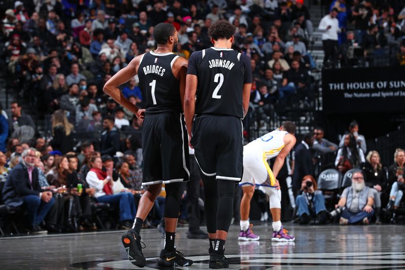 BROOKLYN, NY - FEBRUARY 5: Mikal Bridges #1 and Cameron Johnson #2 of the Brooklyn Nets look on during the game against the Golden State Warriors on February 5, 2024 at Barclays Center in Brooklyn, New York. NOTE TO USER: User expressly acknowledges and agrees that, by downloading and or using this Photograph, user is consenting to the terms and conditions of the Getty Images License Agreement. Mandatory Copyright Notice: Copyright 2024 NBAE (Photo by David L. Nemec/NBAE via Getty Images)