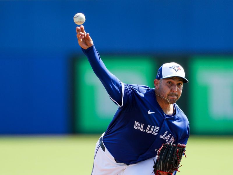 Feb 28, 2024; Dunedin, Florida, USA;  Toronto Blue Jays pitcher Paolo Espino (52) throws a pitch against the Tampa Bay Rays in the second inning at TD Ballpark. Mandatory Credit: Nathan Ray Seebeck-USA TODAY Sports