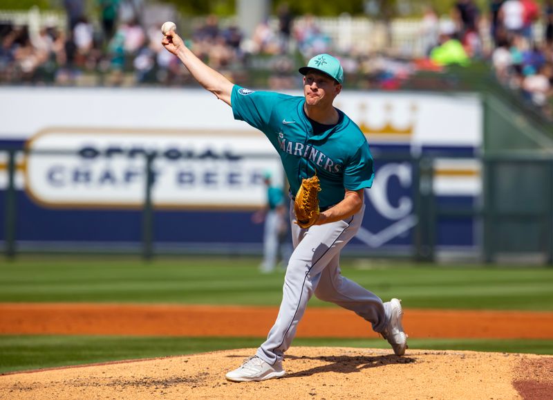 Mar 18, 2024; Surprise, Arizona, USA; Seattle Mariners pitcher Brett de Geus against the Texas Rangers during a spring training baseball game at Surprise Stadium. Mandatory Credit: Mark J. Rebilas-USA TODAY Sports