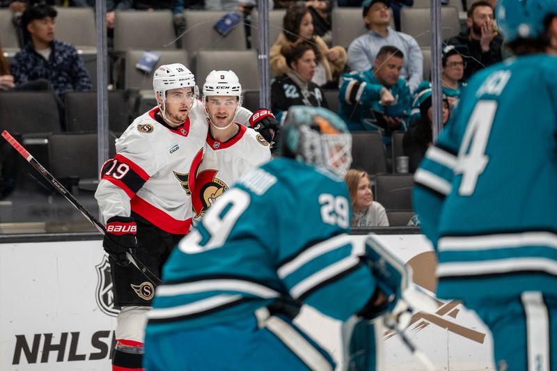 Nov 27, 2024; San Jose, California, USA; Ottawa Senators center Josh Norris (9) and Ottawa Senators right wing Drake Batherson (19) celebrate after the score against San Jose Sharks goaltender Mackenzie Blackwood (29) during the first period at SAP Center at San Jose. Mandatory Credit: Neville E. Guard-Imagn Images