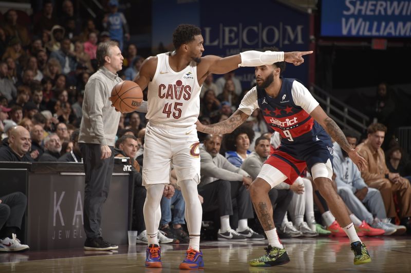 CLEVELAND, OH - DECEMBER 13: Donovan Mitchell #45 of the Cleveland Cavaliers handles the ball during the game against the Washington Wizards on December 13, 2024 at Rocket Mortgage FieldHouse in Cleveland, Ohio. NOTE TO USER: User expressly acknowledges and agrees that, by downloading and/or using this Photograph, user is consenting to the terms and conditions of the Getty Images License Agreement. Mandatory Copyright Notice: Copyright 2024 NBAE (Photo by David Liam Kyle/NBAE via Getty Images)