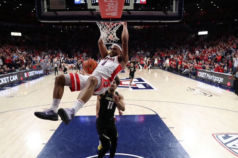 Feb 18, 2023; Tucson, Arizona, USA; Arizona Wildcats guard Kylan Boswell (4) makes a basket against Colorado Buffaloes guard Javon Ruffin (11) during the first half at McKale Center. Mandatory Credit: Zachary BonDurant-USA TODAY Sports