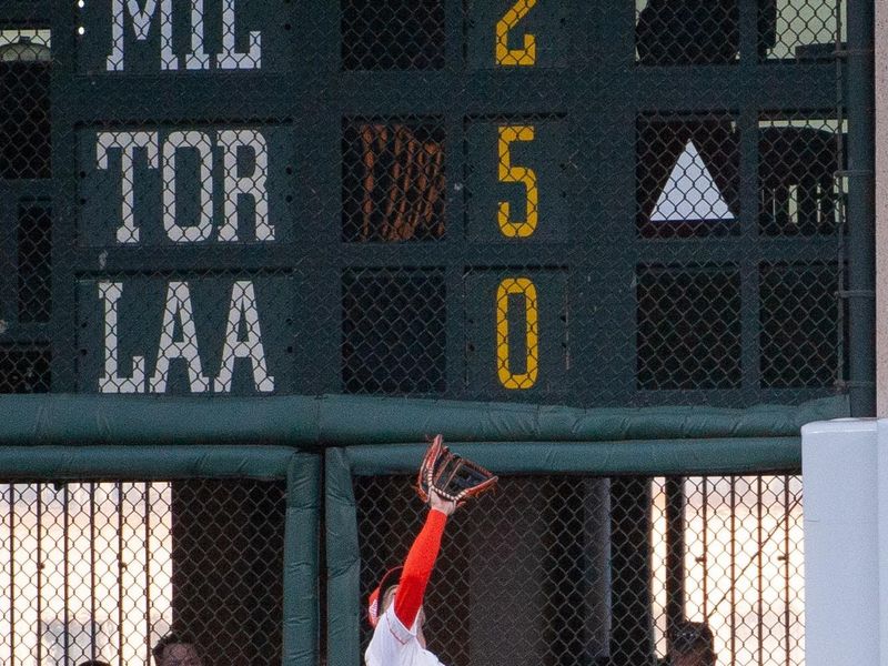 Aug 13, 2024; San Francisco, California, USA;  San Francisco Giants outfielder Mike Yastrzemski (5) makes a catch in the outfield during the fourth inning at Oracle Park. Mandatory Credit: Ed Szczepanski-USA TODAY Sports