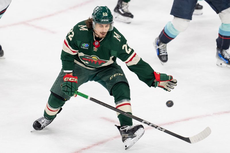 Apr 18, 2024; Saint Paul, Minnesota, USA; Minnesota Wild center Marat Khusnutdinov (22) tries to block a Seattle Kraken shot in the second period at Xcel Energy Center. Mandatory Credit: Matt Blewett-USA TODAY Sports