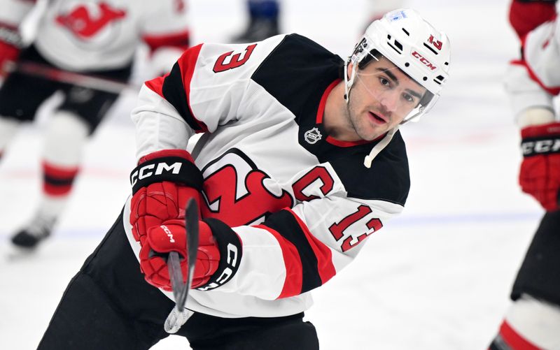 Jan 16, 2025; Toronto, Ontario, CAN;  New Jersey Devils forward Nico Hischier (13) warms up before playing the Toronto Maple Leafs at Scotiabank Arena. Mandatory Credit: Dan Hamilton-Imagn Images