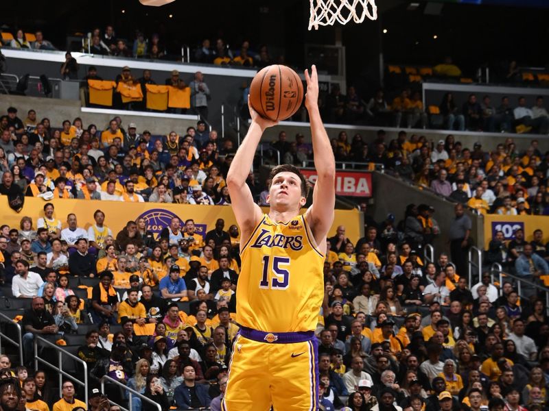 LOS ANGELES, CA - APRIL 25: Austin Reaves #15 of the Los Angeles Lakers drives to the basket during the game against the Denver Nuggets during Round 1 Game 3 of the 2024 NBA Playoffs on April 25, 2024 at Crypto.Com Arena in Los Angeles, California. NOTE TO USER: User expressly acknowledges and agrees that, by downloading and/or using this Photograph, user is consenting to the terms and conditions of the Getty Images License Agreement. Mandatory Copyright Notice: Copyright 2024 NBAE (Photo by Andrew D. Bernstein/NBAE via Getty Images)