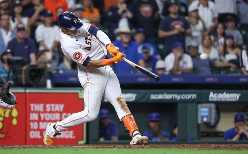 May 17, 2023; Houston, Texas, USA; Houston Astros shortstop Jeremy Pena (3) hits a double during the ninth inning against the Chicago Cubs at Minute Maid Park. Mandatory Credit: Troy Taormina-USA TODAY Sports