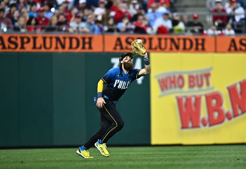 May 17, 2024; Philadelphia, Pennsylvania, USA; Philadelphia Phillies outfielder Brandon Marsh (16) fields a fly ball against the Washington Nationals in the fourth inning at Citizens Bank Park. Mandatory Credit: Kyle Ross-USA TODAY Sports