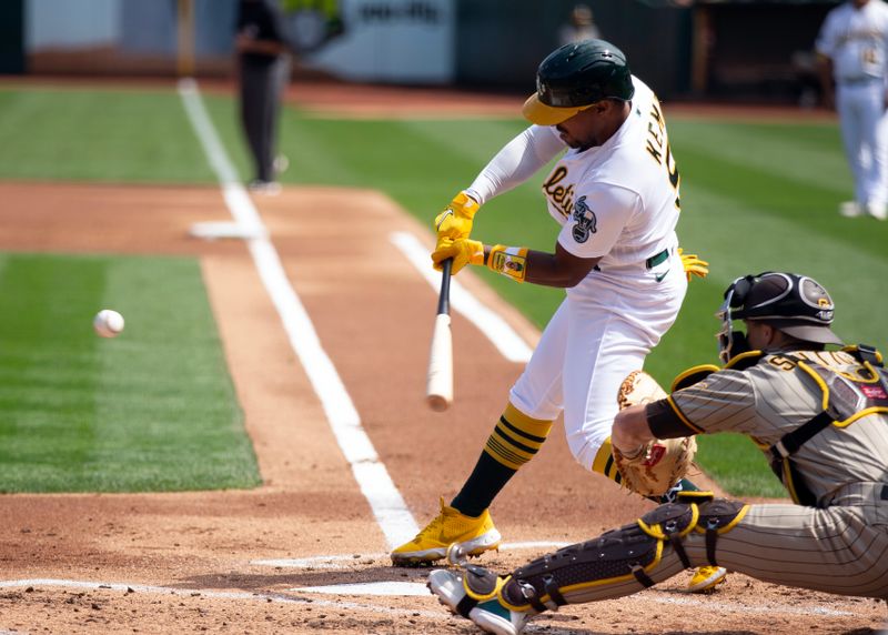 Sep 16, 2023; Oakland, California, USA; Oakland Athletics left fielder Tony Kemp (5) hits a single against the San Diego Padres during the first inning at Oakland-Alameda County Coliseum. Mandatory Credit: D. Ross Cameron-USA TODAY Sports