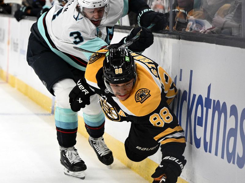 Nov 3, 2024; Boston, Massachusetts, USA; Boston Bruins right wing David Pastrnak (88) controls the puck against Seattle Kraken defenseman Will Borgen (3) during the first period at the TD Garden. Mandatory Credit: Brian Fluharty-Imagn Images