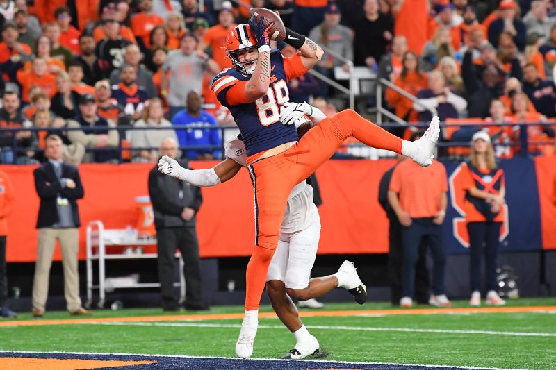 Nov 25, 2023; Syracuse, New York, USA; Syracuse Orange tight end Dan Villari (89) catches the ball for a touchdown as Wake Forest Demon Deacons defensive back Evan Slocum (back) defends during the second half at the JMA Wireless Dome. Mandatory Credit: Rich Barnes-USA TODAY Sports