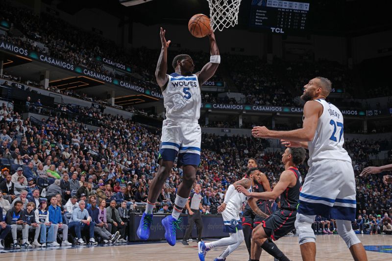 MINNEAPOLIS, MN -  APRIL 3: Anthony Edwards #5 of the Minnesota Timberwolves grabs a rebound during the game against the Toronto Raptors  on April 3, 2024 at Target Center in Minneapolis, Minnesota. NOTE TO USER: User expressly acknowledges and agrees that, by downloading and or using this Photograph, user is consenting to the terms and conditions of the Getty Images License Agreement. Mandatory Copyright Notice: Copyright 2024 NBAE (Photo by Jordan Johnson/NBAE via Getty Images)