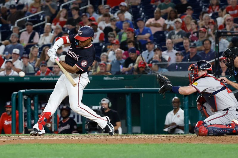 Sep 11, 2024; Washington, District of Columbia, USA; Washington Nationals third baseman Jose Tena (8) singles against the Atlanta Braves during the eighth inning at Nationals Park. Mandatory Credit: Geoff Burke-Imagn Images