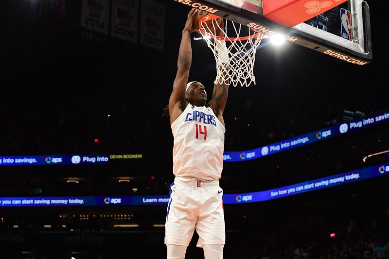 PHOENIX, AZ - APRIL  16: Terance Mann #14 of the LA Clippers dunks the ball during Round One Game One of the 2023 NBA Playoffs on April 16, 2023 at Footprint Center in Phoenix, Arizona. NOTE TO USER: User expressly acknowledges and agrees that, by downloading and or using this photograph, user is consenting to the terms and conditions of the Getty Images License Agreement. Mandatory Copyright Notice: Copyright 2023 NBAE (Photo by Kate Frese/NBAE via Getty Images)