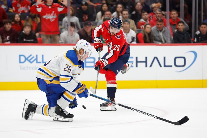 Nov 22, 2023; Washington, District of Columbia, USA; Buffalo Sabres defenseman Rasmus Dahlin (26) blocks the shot of Washington Capitals center Hendrix Lapierre (29) in the third period at Capital One Arena. Mandatory Credit: Geoff Burke-USA TODAY Sports