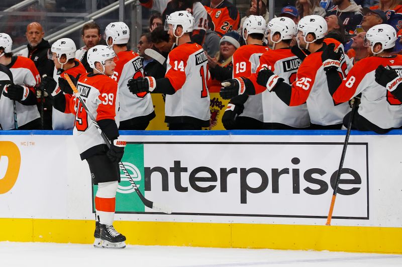 Oct 15, 2024; Edmonton, Alberta, CAN; The celebrate a goal scored by forward Matvei Michkov (39) during the first period against the Edmonton Oilers at Rogers Place. Mandatory Credit: Perry Nelson-Imagn Images