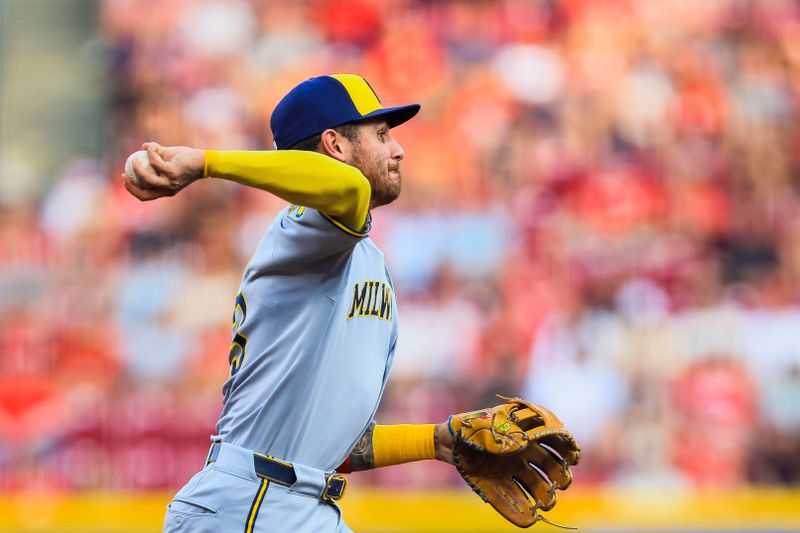 Jun 3, 2025; Cincinnati, Ohio, USA; Milwaukee Brewers shortstop Joey Ortiz (3) throws to first to get Cincinnati Reds second baseman Matt McLain (not pictured) out in the third inning at Great American Ball Park. Mandatory Credit: Katie Stratman-Imagn Images