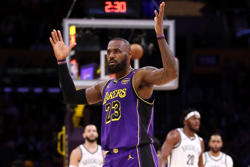 LOS ANGELES, CALIFORNIA - JANUARY 17: LeBron James #23 of the Los Angeles Lakers celebrates a three-point basket at the end of the first quarter against the Brooklyn Nets at Crypto.com Arena on January 17, 2025 in Los Angeles, California. NOTE TO USER: User expressly acknowledges and agrees that, by downloading and/or using this Photograph, user is consenting to the terms and conditions of the Getty Images License Agreement. (Photo by Katelyn Mulcahy/Getty Images)