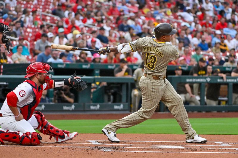 Aug 28, 2024; St. Louis, Missouri, USA;  San Diego Padres third baseman Manny Machado (13) hits a one run single against the St. Louis Cardinals during the first inning at Busch Stadium. Mandatory Credit: Jeff Curry-USA TODAY Sports
