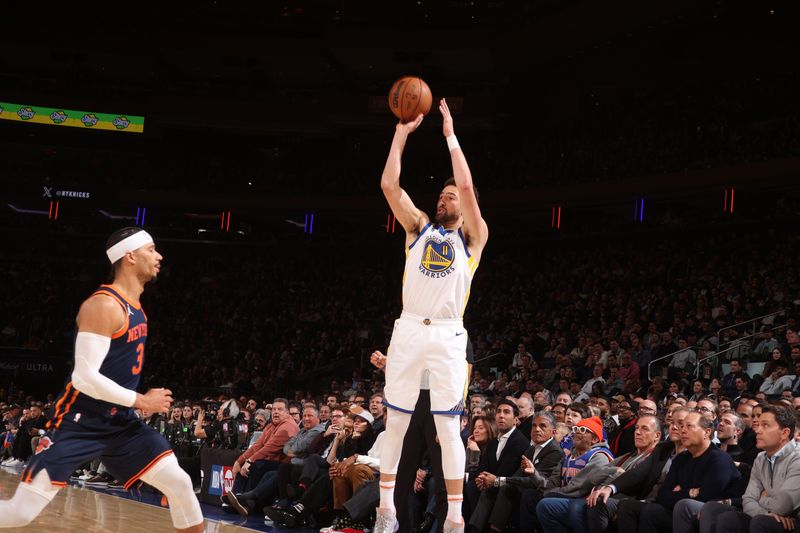 NEW YORK, NY - FEBRUARY 29: Klay Thompson #11 of the Golden State Warriors shoots a three point basket against the New York Knicks on January 29, 2024 at Madison Square Garden in New York City, New York.  NOTE TO USER: User expressly acknowledges and agrees that, by downloading and or using this photograph, User is consenting to the terms and conditions of the Getty Images License Agreement. Mandatory Copyright Notice: Copyright 2024 NBAE  (Photo by Nathaniel S. Butler/NBAE via Getty Images)