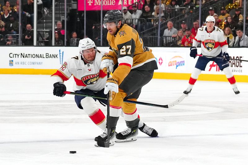 Jan 26, 2025; Las Vegas, Nevada, USA; Florida Panthers defenseman Dmitry Kulikov (7) collides with Vegas Golden Knights defenseman Shea Theodore (27) during the first period at T-Mobile Arena. Mandatory Credit: Stephen R. Sylvanie-Imagn Images