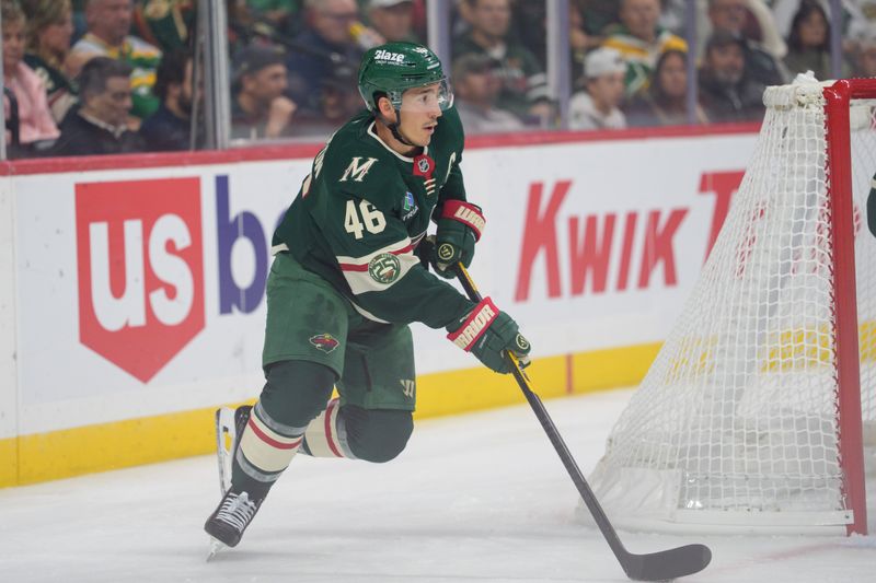 Oct 13, 2025; Saint Paul, Minnesota, USA; Minnesota Wild defenseman Jared Spurgeon (46) carries the puck out from behind his net against the Los Angeles Kings in the first period at Grand Casino Arena. Mandatory Credit: Matt Blewett-Imagn Images
