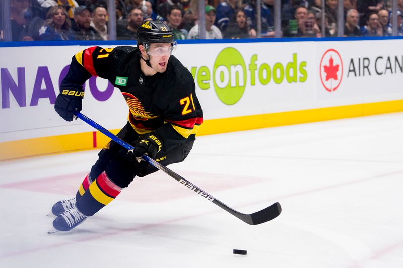 Jan 20, 2024; Vancouver, British Columbia, CAN; Vancouver Canucks forward Nils Hoglander (21) handles the puck against the Toronto Maple Leafs in the first period at Rogers Arena. Mandatory Credit: Bob Frid-USA TODAY Sports