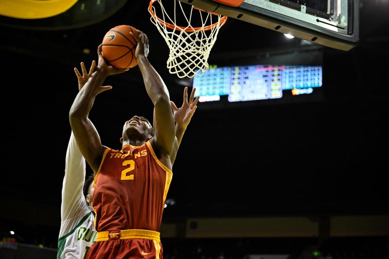 Dec 2, 2025; Eugene, Oregon, USA; Southern California Trojans forward Ezra Ausar (2) drives to the basket against the Oregon Ducks during the second half at Matthew Knight Arena. Mandatory Credit: Craig Strobeck-Imagn Images