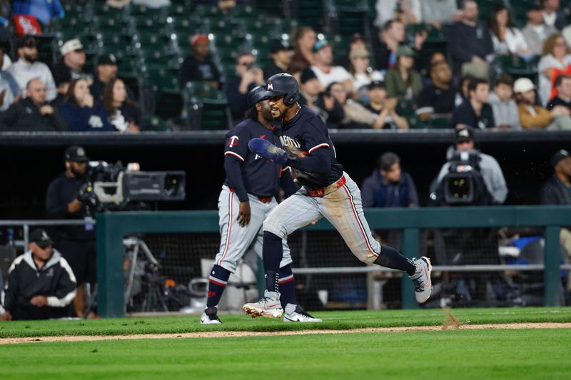 Apr 30, 2024; Chicago, Illinois, USA; Minnesota Twins outfielder Byron Buxton (25) runs to score against the Chicago White Sox during the ninth inning at Guaranteed Rate Field. Mandatory Credit: Kamil Krzaczynski-USA TODAY Sports