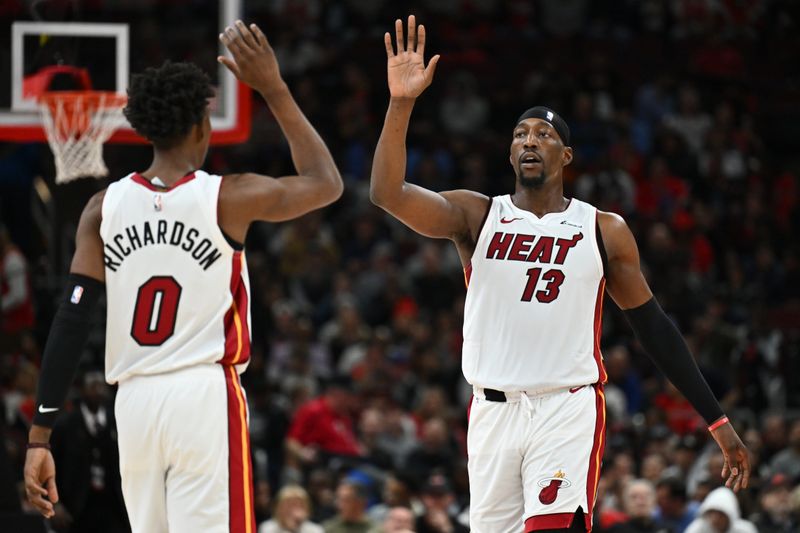 CHICAGO, ILLINOIS - NOVEMBER 18:  Bam Adebayo #13 of the Miami Heat celebrates with Josh Richardson #0 of the Miami Heat after making a basket against the Chicago Bulls on November 18, 2023 at United Center in Chicago, Illinois.   NOTE TO USER: User expressly acknowledges and agrees that, by downloading and or using this photograph, User is consenting to the terms and conditions of the Getty Images License Agreement.  (Photo by Jamie Sabau/Getty Images)