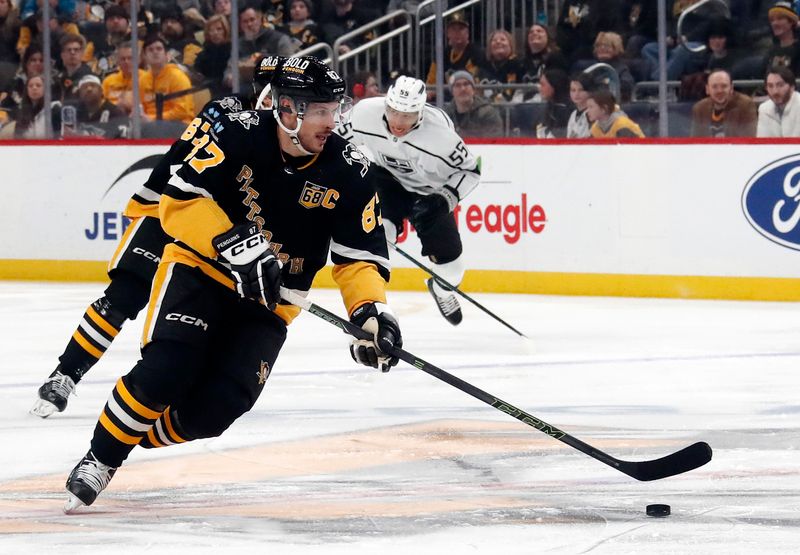 Feb 18, 2024; Pittsburgh, Pennsylvania, USA;  Pittsburgh Penguins center Sidney Crosby (87) skates up ice with the puck against the Los Angeles Kings during the first period at PPG Paints Arena. Mandatory Credit: Charles LeClaire-USA TODAY Sports