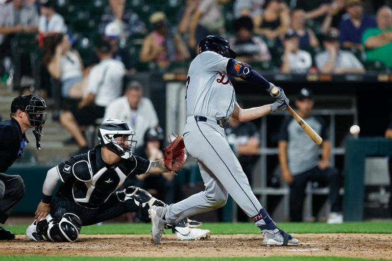 Aug 26, 2024; Chicago, Illinois, USA; Detroit Tigers second baseman Colt Keith (33) singles against the Chicago White Sox during the seventh inning at Guaranteed Rate Field. Mandatory Credit: Kamil Krzaczynski-USA TODAY Sports