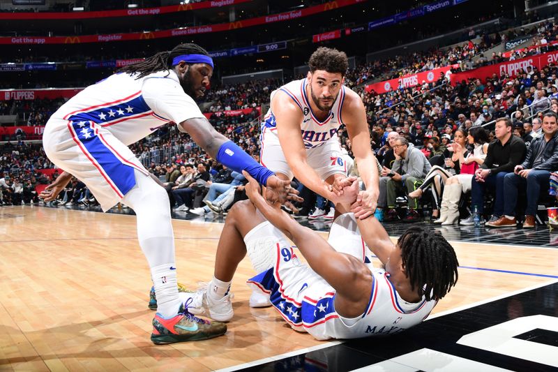 LOS ANGELES, CA - JANUARY 17: Tyrese Maxey #0 of the Philadelphia 76ers is helped up during the game against the LA Clippers on January 17, 2023 at Crypto.Com Arena in Los Angeles, California. NOTE TO USER: User expressly acknowledges and agrees that, by downloading and/or using this Photograph, user is consenting to the terms and conditions of the Getty Images License Agreement. Mandatory Copyright Notice: Copyright 2023 NBAE (Photo by Adam Pantozzi/NBAE via Getty Images)