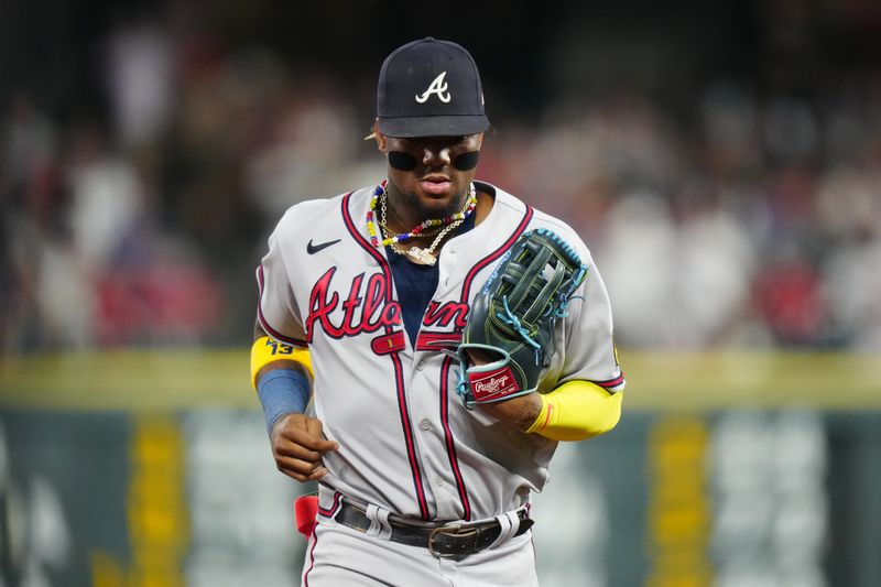 Aug 30, 2023; Denver, Colorado, USA; Atlanta Braves right fielder Ronald Acuna Jr. (13) leaves the field in the fourth inning against the Colorado Rockies at Coors Field. Mandatory Credit: Ron Chenoy-USA TODAY Sports