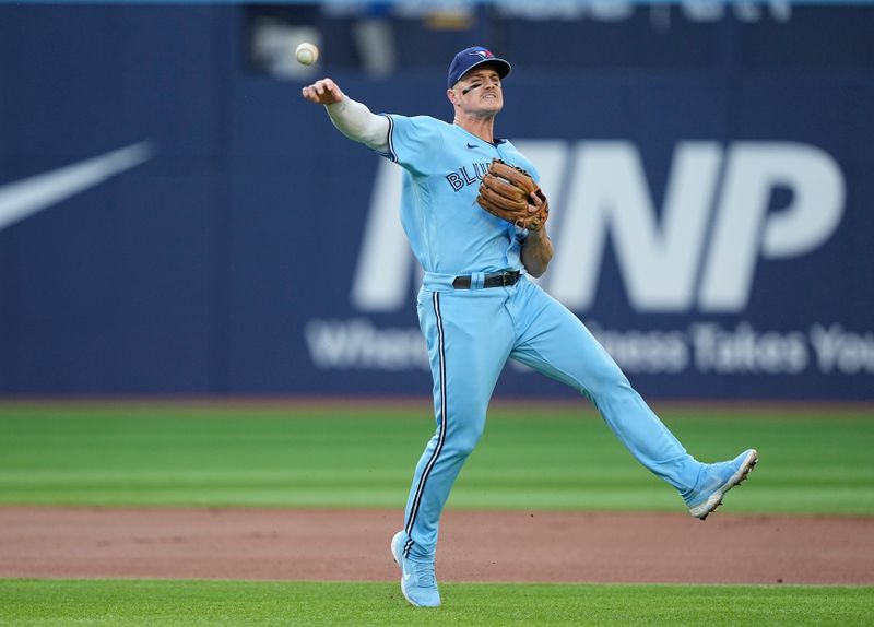 May 30, 2023; Toronto, Ontario, CAN; Toronto Blue Jays third baseman Matt Chapman (26) throws to first base to get Milwaukee Brewers designated hitter Darin Ruf (not pictured) out during the first inning at Rogers Centre. Mandatory Credit: John E. Sokolowski-USA TODAY Sports