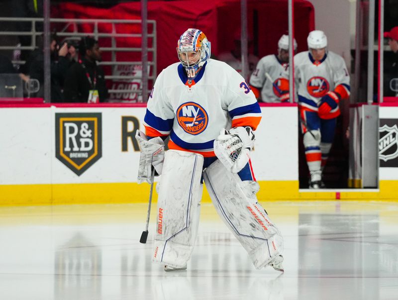 Dec 23, 2023; Raleigh, North Carolina, USA; New York Islanders goaltender Ilya Sorokin (30) skates out onto the ice before the game against the Carolina Hurricanes at PNC Arena. Mandatory Credit: James Guillory-USA TODAY Sports