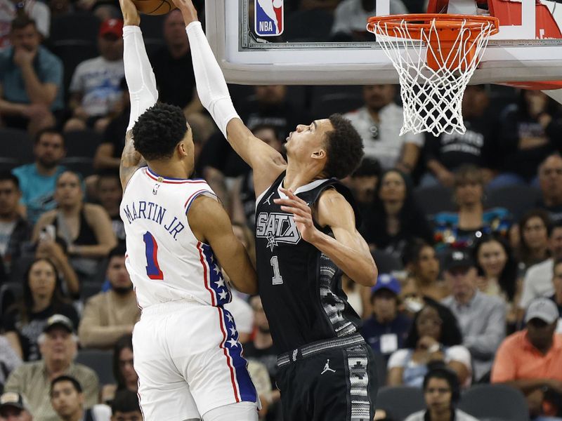 SAN ANTONIO, TX - APRIL 07: Victor Wembanyama #1 of the San Antonio Spurs blocks shot of KJ Martin #1 of the Philadelphia 76ers in the first half at Frost Bank Center on April 7, 2024 in San Antonio, Texas. NOTE TO USER: User expressly acknowledges and agrees that, by downloading and or using this photograph, User is consenting to terms and conditions of the Getty Images License Agreement. (Photo by Ronald Cortes/Getty Images)