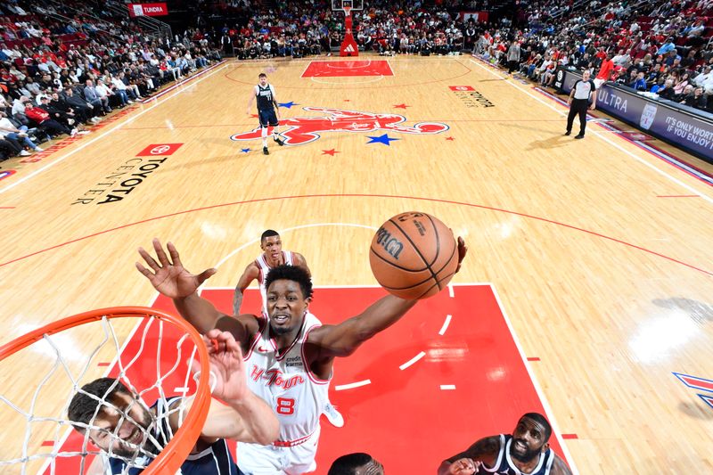 HOUSTON, TX - MARCH 31: Jae'Sean Tate #8 of the Houston Rockets drives to the basket during the game against the Dallas Mavericks on March 31, 2024 at the Toyota Center in Houston, Texas. NOTE TO USER: User expressly acknowledges and agrees that, by downloading and or using this photograph, User is consenting to the terms and conditions of the Getty Images License Agreement. Mandatory Copyright Notice: Copyright 2024 NBAE (Photo by Logan Riely/NBAE via Getty Images)