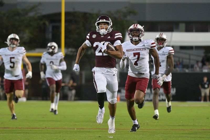 Nov 2, 2024; Starkville, Mississippi, USA; Mississippi State Bulldogs running back Xavier Gayten (22) runs the ball against the Massachusetts Minutemen during the fourth quarter at Davis Wade Stadium at Scott Field. Mandatory Credit: Matt Bush-Imagn Images