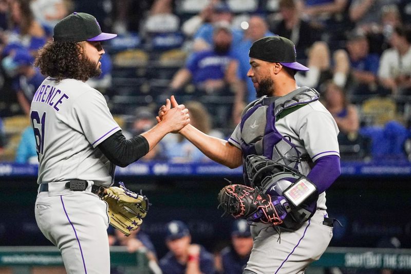 Jun 2, 2023; Kansas City, Missouri, USA; Colorado Rockies relief pitcher Justin Lawrence (61) celebrates with catcher Elias Diaz (35) after defeating the Kansas City Royals at Kauffman Stadium. Mandatory Credit: Denny Medley-USA TODAY Sports