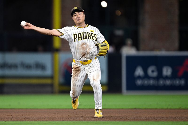 Jun 11, 2024; San Diego, California, USA; San Diego Padres shortstop Ha-Seong Kim (7) throws to first base on a ground out by Oakland Athletics pinch-hitter Shea Langeliers (not pictured) during the seventh inning at Petco Park. Mandatory Credit: Orlando Ramirez-USA TODAY Sports