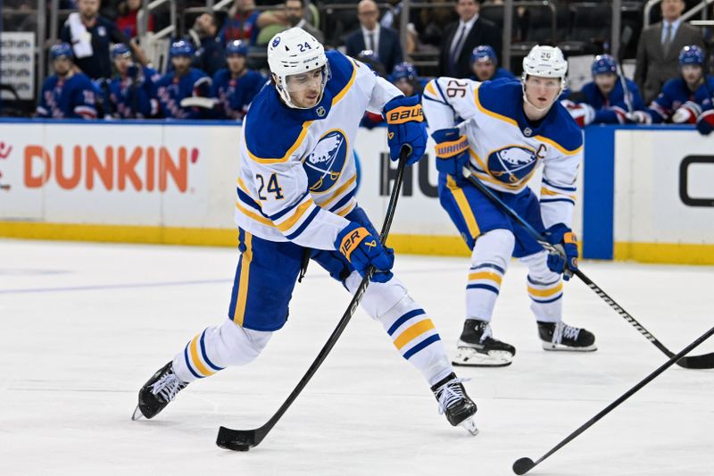 Nov 7, 2024; New York, New York, USA;  Buffalo Sabres center Dylan Cozens (24) shoots against the New York Rangers during the third period at Madison Square Garden. Mandatory Credit: Dennis Schneidler-Imagn Images