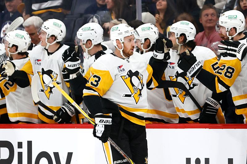 Oct 20, 2024; Winnipeg, Manitoba, CAN; Pittsburgh Penguins right wing Kevin Hayes (13) celebrates his second period goal against the Winnipeg Jets at Canada Life Centre. Mandatory Credit: James Carey Lauder-Imagn Images