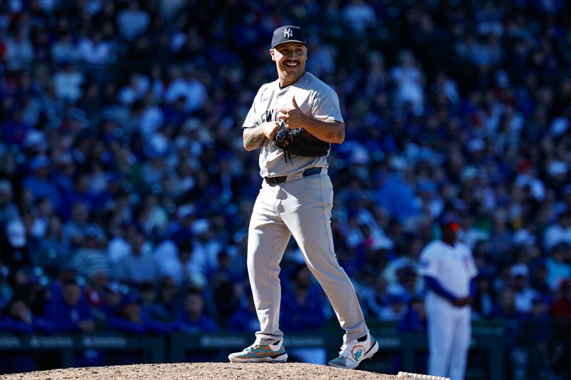 Sep 7, 2024; Chicago, Illinois, USA; New York Yankees relief pitcher Nestor Cortes (65) smiles during the ninth inning of a baseball game against the Chicago Cubs at Wrigley Field. Mandatory Credit: Kamil Krzaczynski-Imagn Images